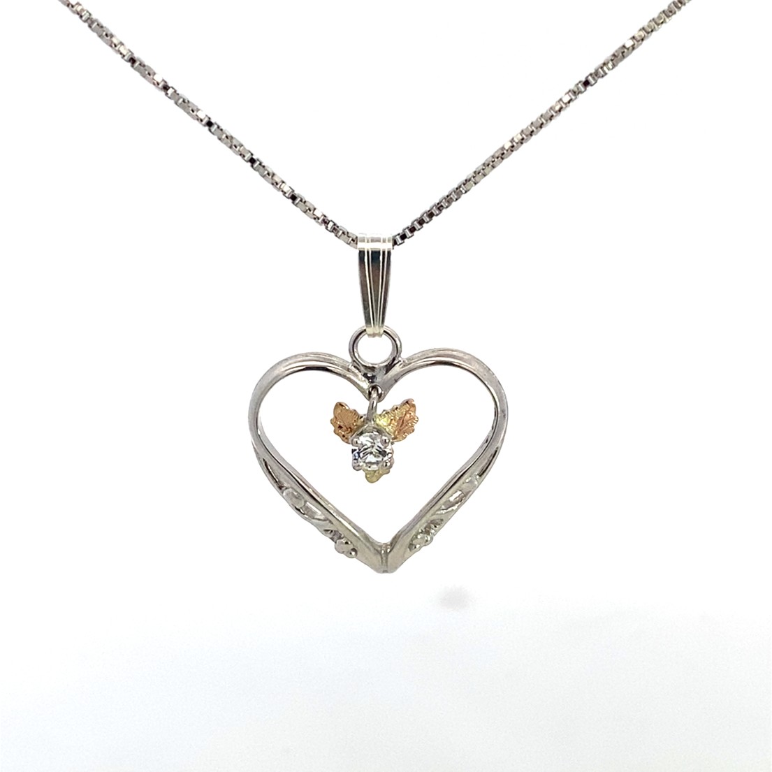 Featured image for “Sterling Silver Heart Pendant with White Sapphire”